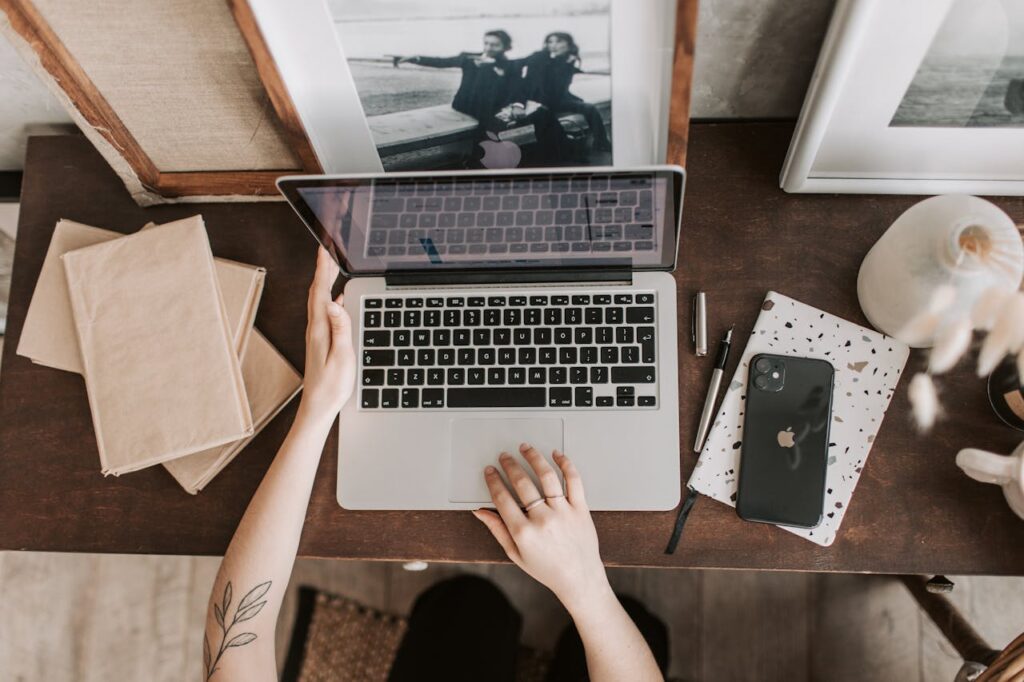 Person working on affiliate marketing strategies using a laptop, focusing on tools and tips for online success.