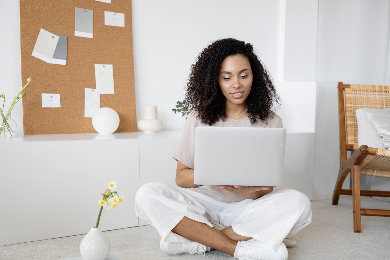 Woman with laptop excited about affiliate marketing tools and tips.