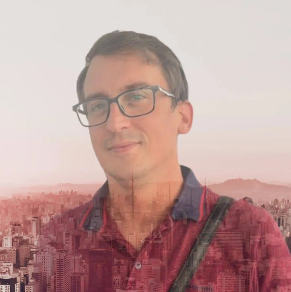 Filip Doric smiling in workspace – offering FilipDoric.com digital solutions for freelancers and creatives seeking online growth.